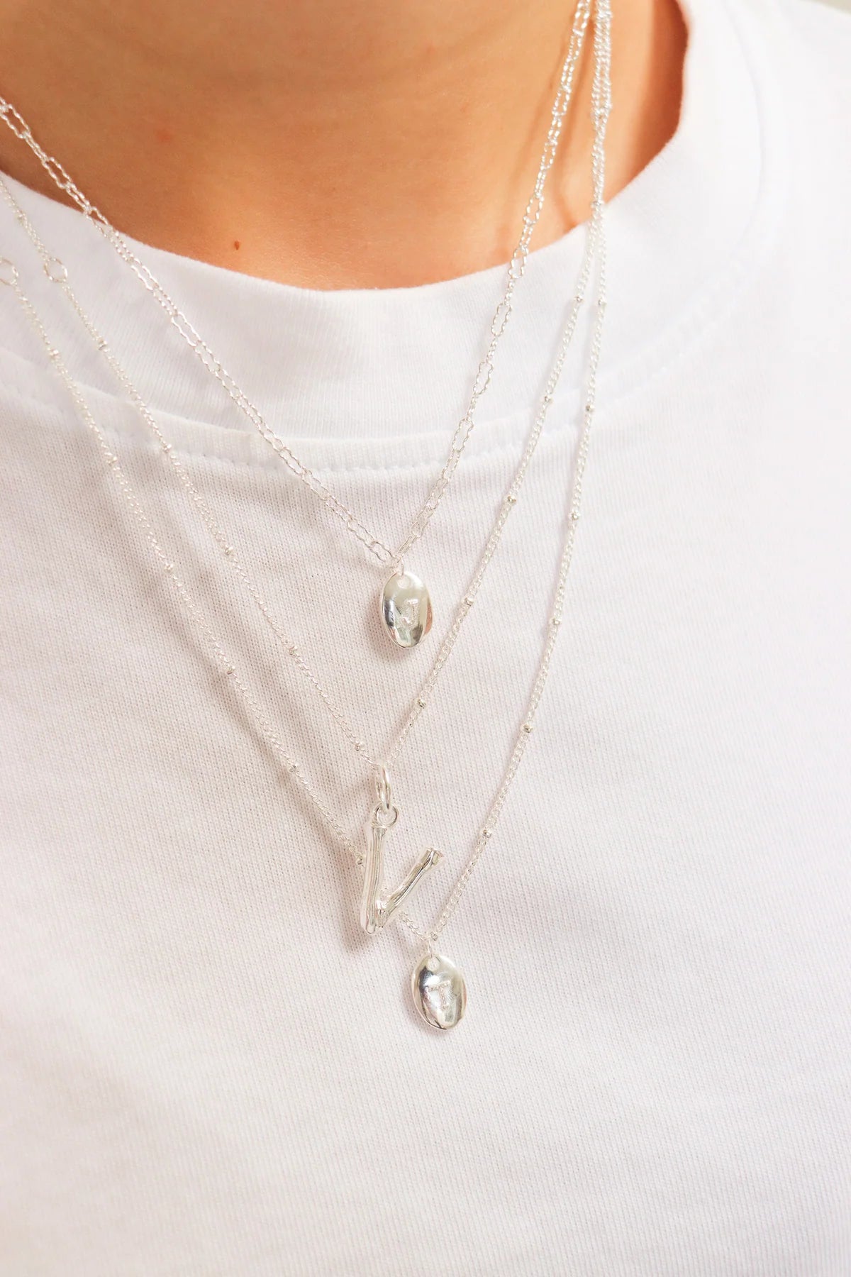 Letter dots charm silver