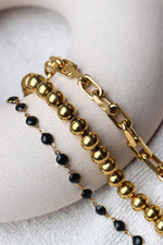 Black round bracelet gold