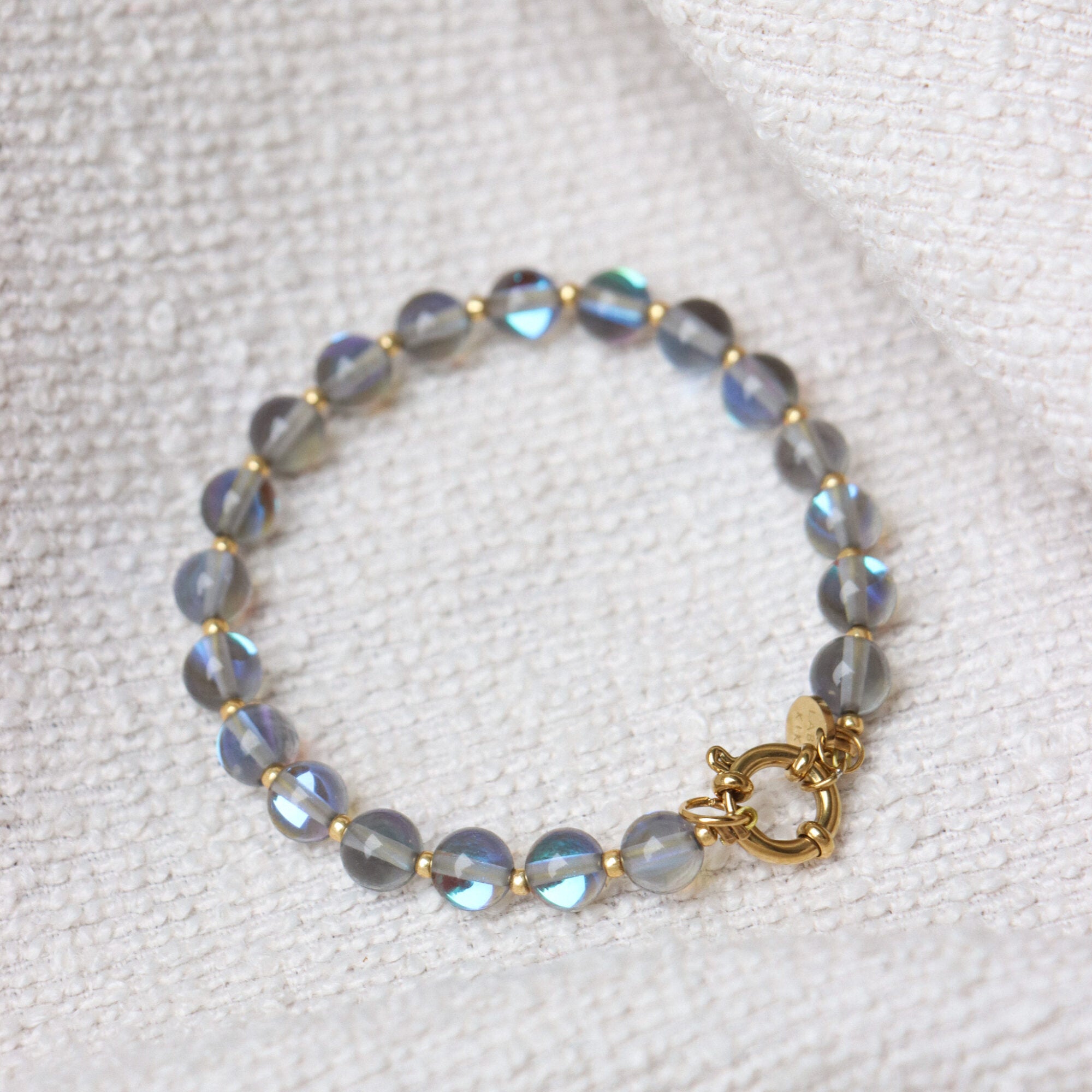 Grey flame bracelet gold