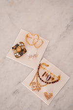 Double heart broche gold